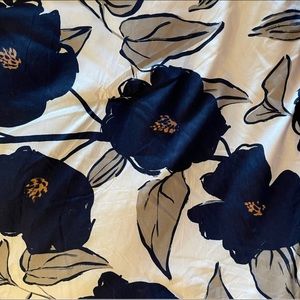 White comforter with blue flowers